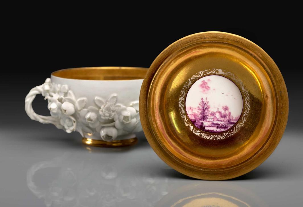 gold and white porcelain bowl and dish with mauve scene at center