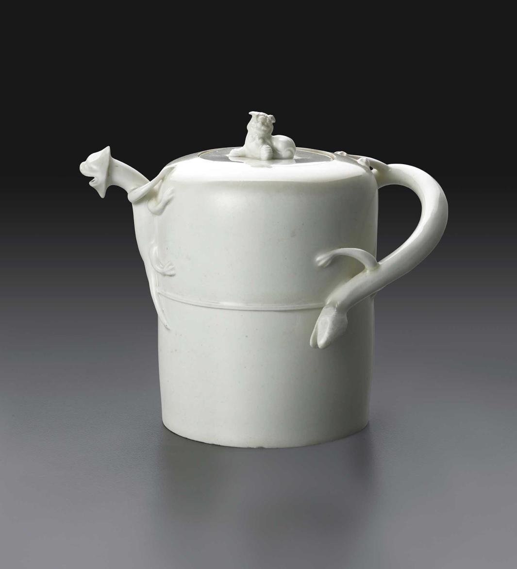 cylindrical white teapot with dragon spout