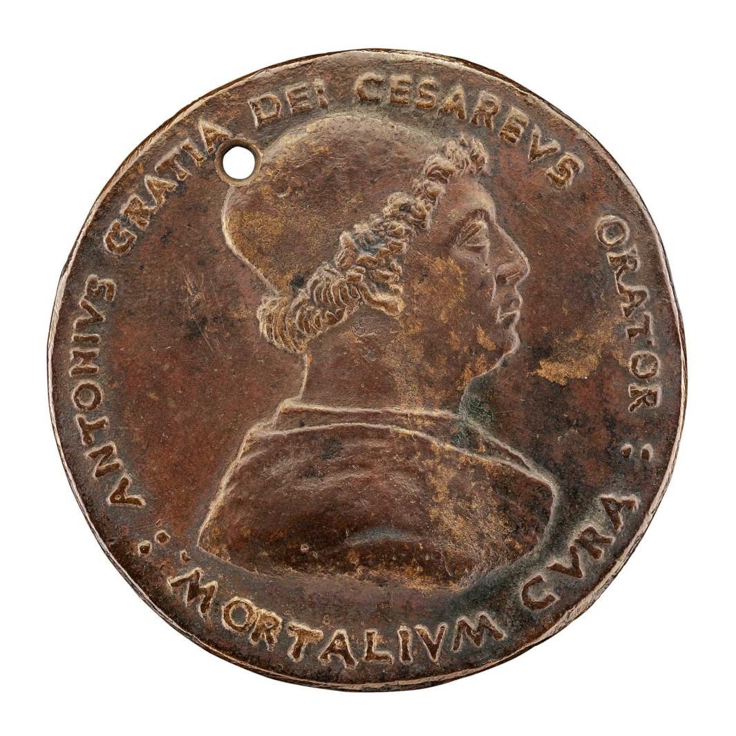 Bronze medal of a man in profile.