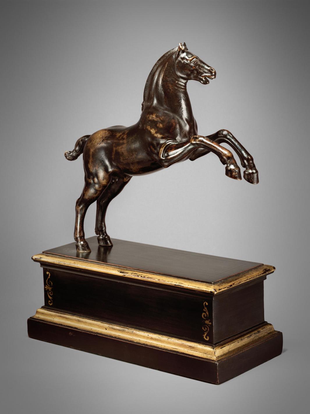 Bronze sculpture of a rearing horse.