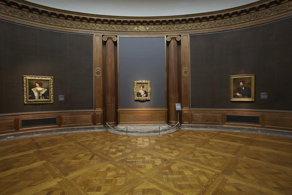 Photograph of the Frick's Oval Room with three paintings