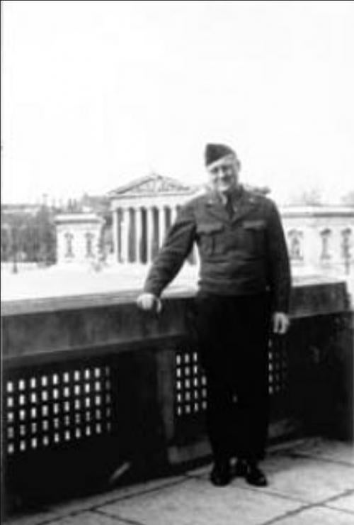 WWII era photograph of soldier Andrew Carnduff Ritchie in front of a museum