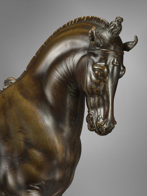 Close up of bronze sculpture of a horse.