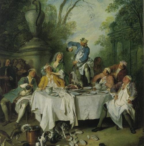 Painting of lively feasting scene with figures around a table and dogs in the foreground.