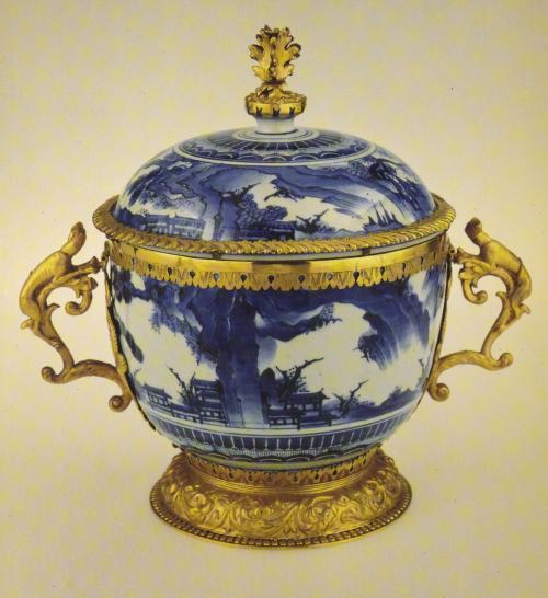 Image of blue and white lidded porcelain piece with gold handles and accents