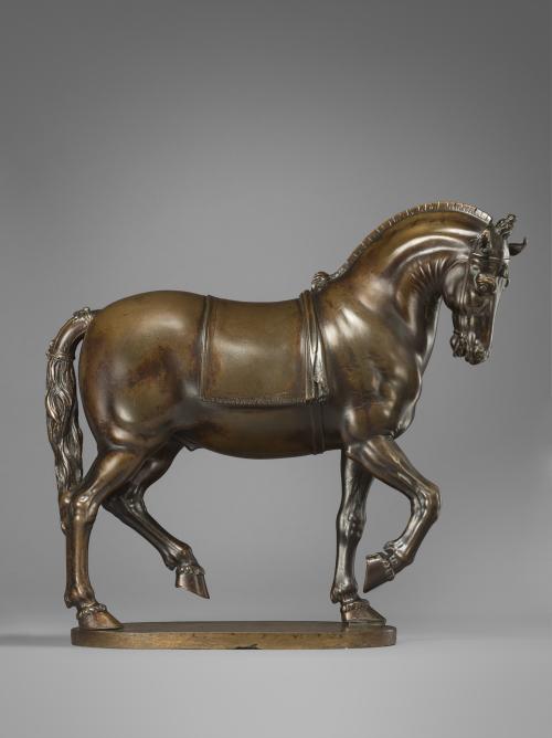 Bronze sculpture of a pacing horse.