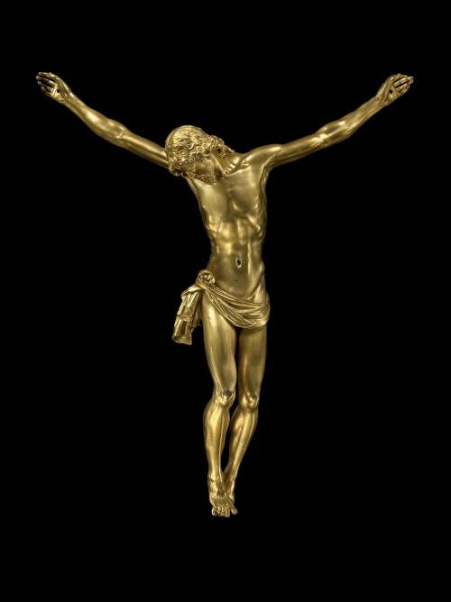 Bronze sculpture of Jesus Christ being crucified.