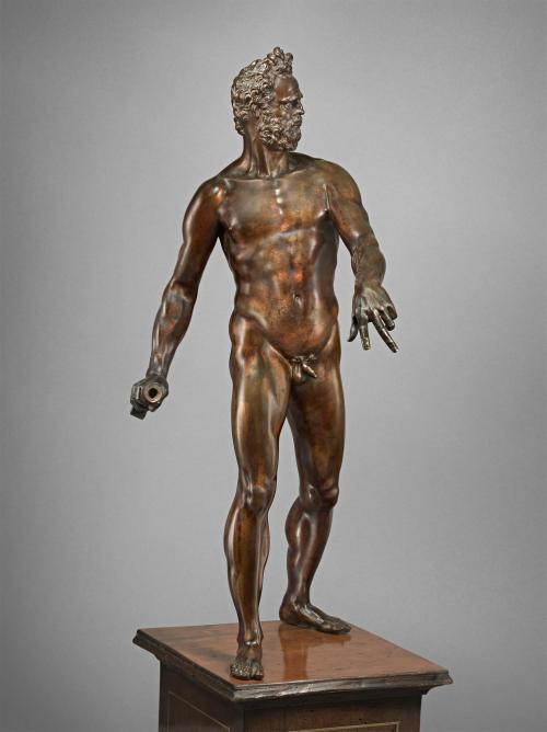 Bronze sculpture of standing man.