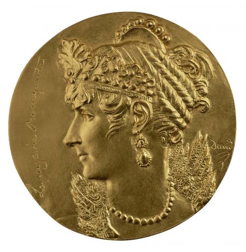 Gilt bronze portrait medal of Joséphine Bonaparte, hair braided around head and held in place with a fillet, wearing a tiara of oak leaves and acorns, a comb or tiara edged with pearls, a pendant earring, a pearl necklace, and a delicate, high-standing lace collar 