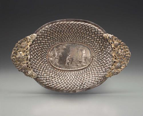 oval-shaped silver basket with handles
