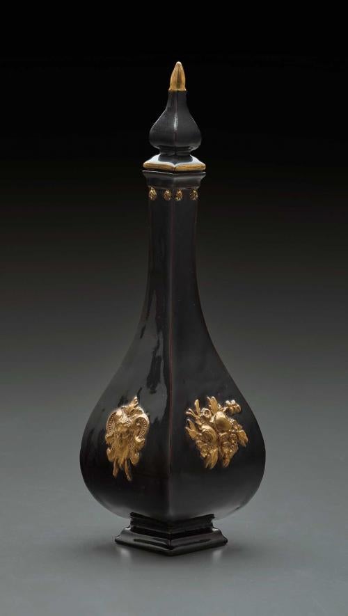 Black-glazed porcelain four-sided bottle with stopper.