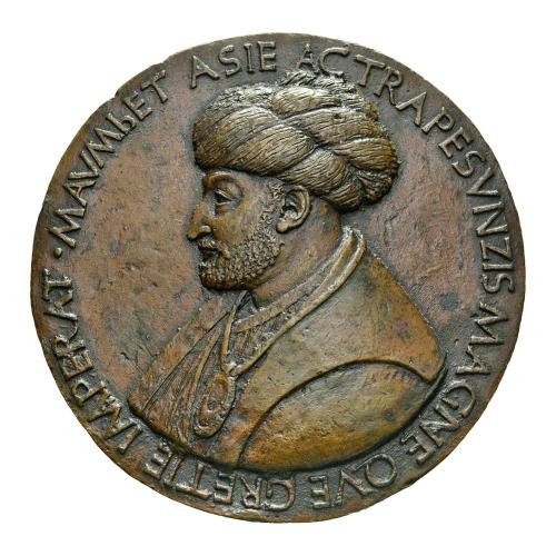 Bronze medal depicting a man in profile wearing a turban, and a large necklace.