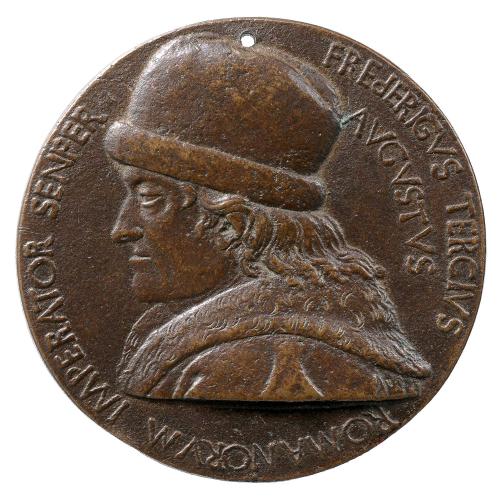 Obverse of a bronze medal depicting a man in profile.