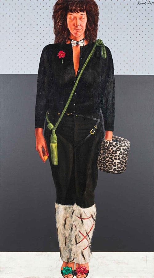 Portrait of a woman in a black shirt and pants with furry legwarmers holding a leopard print muff.