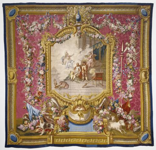 Tapestry of Don Quixote and Sancho and figures of Folly by Wisdom with a red, gold, and floral border