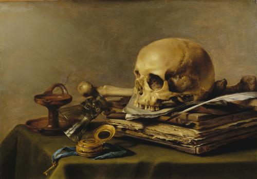 A human skull, a timepiece, a blue ribbon, an oil lamp and a stack of paper on a table.