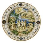 large dish painted with scene of mythological figures, ringed in white with decoration