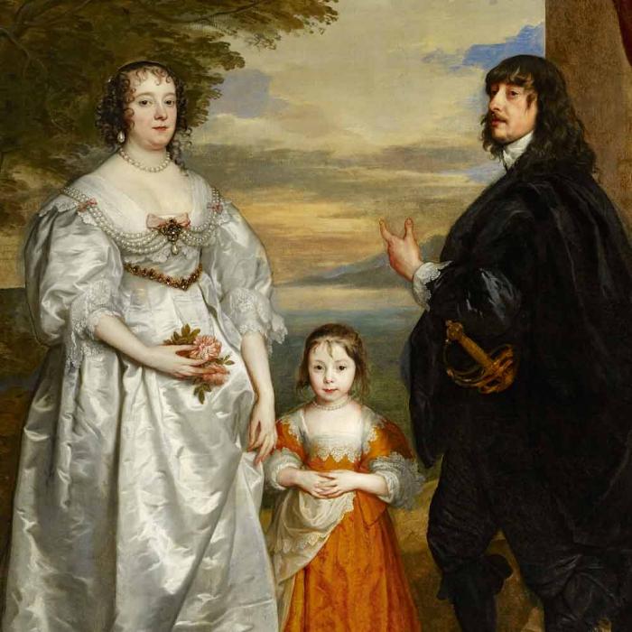 portrait of a family with young girl in red dress