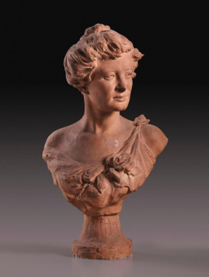 Terracotta bust of a young women in three-quarter view facing right