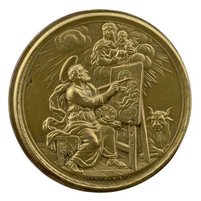 Gilt bronze medal of a man with a halo seated before a canvas on an easel, on which he is painting the Virgin and Child, holding a palette in his left hand, as he looks up at the Virgin and Child in heaven. Behind the easel is a bull, lying on the floor.