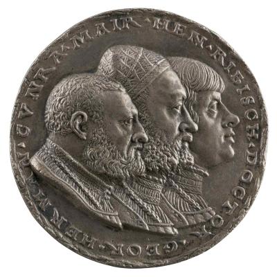 Silver medal of jugate portraits of three men, each wearing shirts with ornamented collars and chains