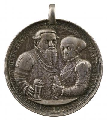 Silver medal of a man holding an hourglass surmounted by skull and a woman holding a book with her left hand