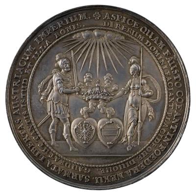 Silver medal depicting the figures of mars and Minerva holding the royal crown of Poland above two hearts bearing the coats of arms of Poland and Austria