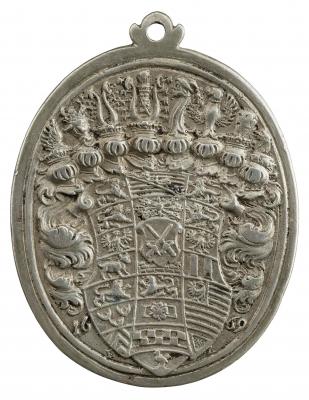 Silver medal with a coat of arms