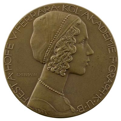 Copper medal of a woman in profile to the right