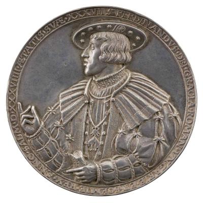 Silver medal of a man in profile to the left wearing a broad-rimmed hat and the Order of the Golden Fleece, and holding a scroll in left hand