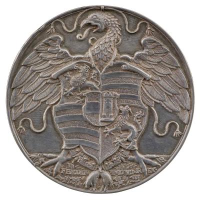 Silver medal depicting an eagle from which hangs a shield of arms and the collar of the Golden Fleece