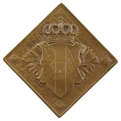 Copper medal depicting a crown over a coat of arms