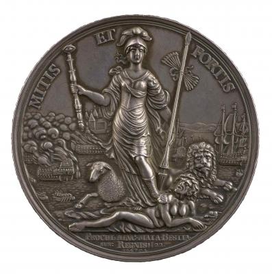 Silver medal depicting a female wearing a helmet, breastplate and high laced sandals. She holds a scepter with an eye of Justice at the top in her right and, in her left, a lance to which is tied 7 arrows representing the 7 provinces of the Netherlands. Flanked by a lion and a lamb, she stands on the naked gorgon-headed female figure of Envy who holds a heart and a snake in her hands. Behind her are warships at sea, and in the back, the castle of Breda