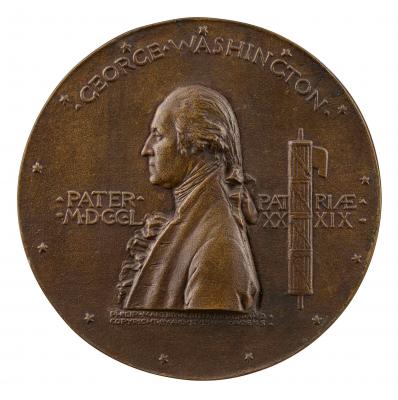 Bronze medal of a man in profile to the left with hair in a ponytail, wearing a jacket over a ruffled shirt and cravat
