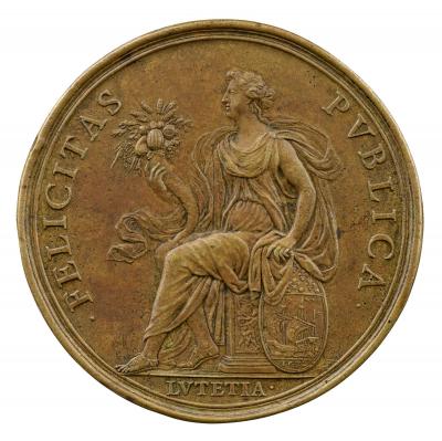 Bronze medal depicting a draped figure sitting on a base, holding a cornucopia in her right hand, and resting her left hand on a shield