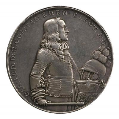 Silver medal of a standing man facing the right and wearing armor, cravat, and Order of the Golden Fleece