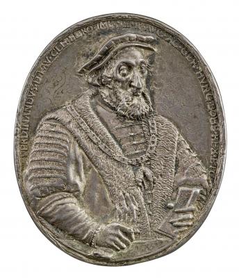 Silver medal of a man wearing a cap and a collar of the Order of the Golden Fleece, holding gloves in his left hand and a letter in his right