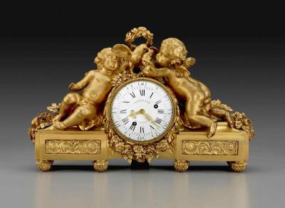 Clock surrounded by gilt-bronze sculptures of flowers, two babies, and doves