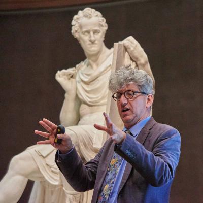 photo of Kenneth Lapatin giving talk in front of sculpture of George Washington