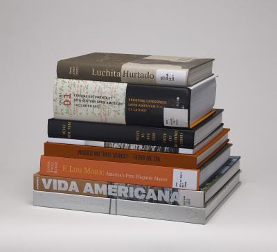 Horizontal stack of 8 library books on Hispanic American art history
