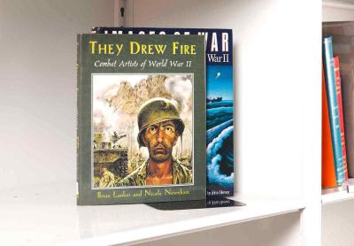 Two books stacked. The front cover features an artwork detail of a shell-shocked soldier.