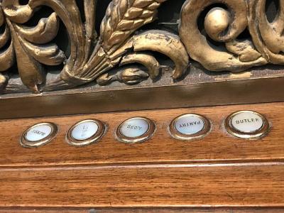 Five labeled buttons underneath decorative gold molding