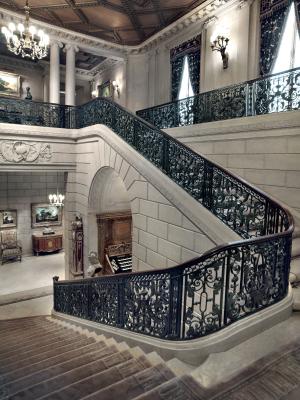 A staircase with a wrought iron railing