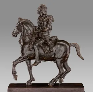 Bronze sculpture of a man on horseback.