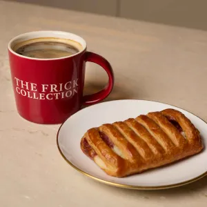 coffee in ceramic cup and pastry on plate