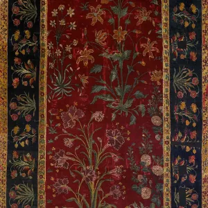 Dark red and dark blue rectangular Indian rug with floral design