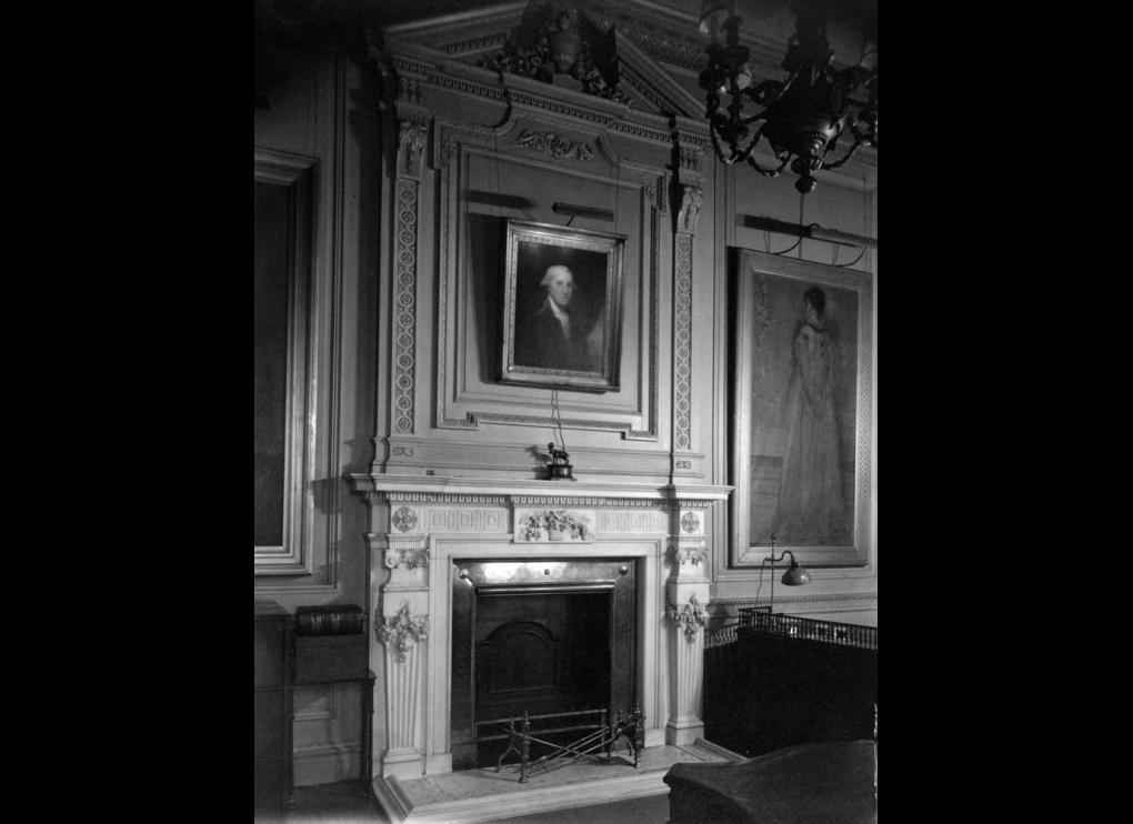 interior with fireplace and paintings